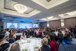 A room-full of people at the 2023 FCAN Summit