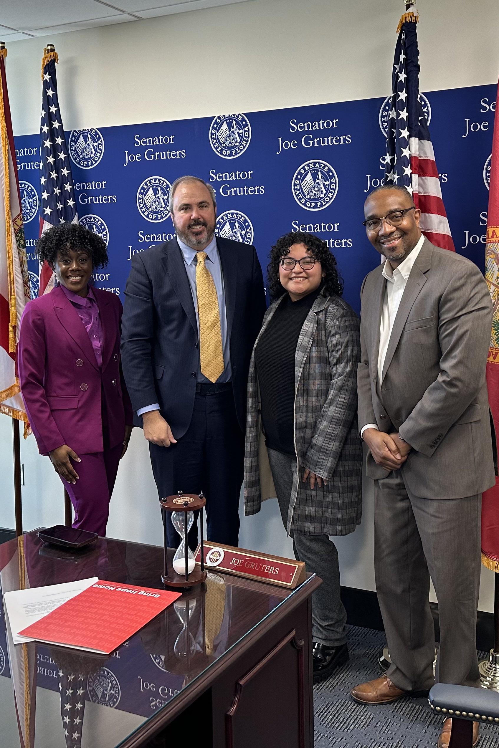 L-R Jailynn Youmas, Senator Joe Gruters (R – 22), PLANit Sarasota Director Thomas Williams, and Giselle Galvan.